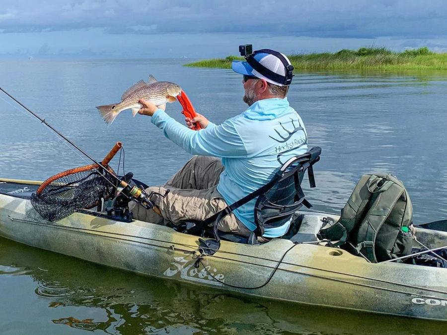 Angler kayak fishing in the back bays of Gulf Shores