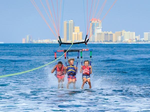 Boy parasailing Orange Beach